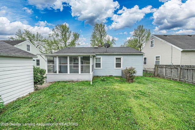 2018 Cooper Ave, Lansing, MI 48910 - rear view of property featuring a sunroom