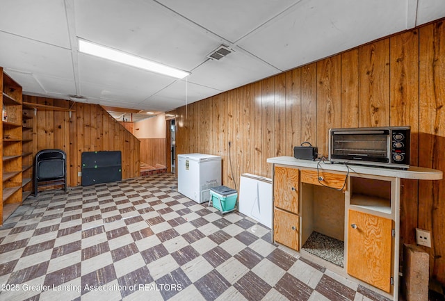 2018 Cooper Ave, Lansing, MI 48910 - unfurnished office with light flooring and wooden walls