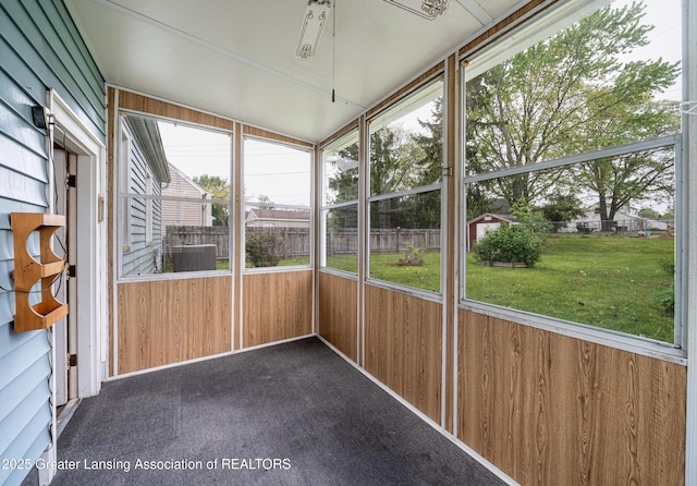 2018 Cooper Ave, Lansing, MI 48910 - unfurnished sunroom featuring plenty of natural light and ceiling fan