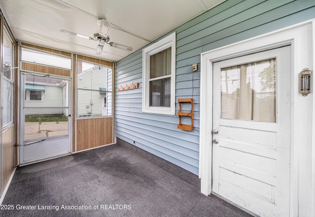 2018 Cooper Ave, Lansing, MI 48910 - unfurnished sunroom featuring plenty of natural light and a ceiling fan