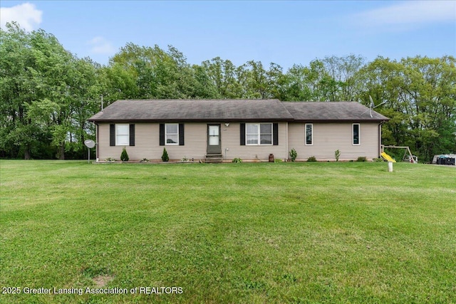 5669 Elm Rd, Olivet, MI 49076 - single story home featuring a front yard and view of wooded area