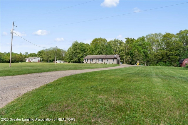 5669 Elm Rd, Olivet, MI 49076 - view of grassy yard featuring gravel driveway