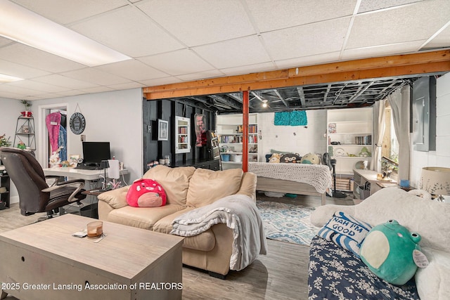 985 Ives Rd, Mason, MI 48854 - bedroom featuring wood finished floors and a paneled ceiling