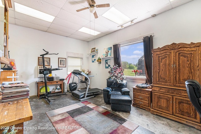 985 Ives Rd, Mason, MI 48854 - office area featuring concrete flooring, ceiling fan, and a drop ceiling