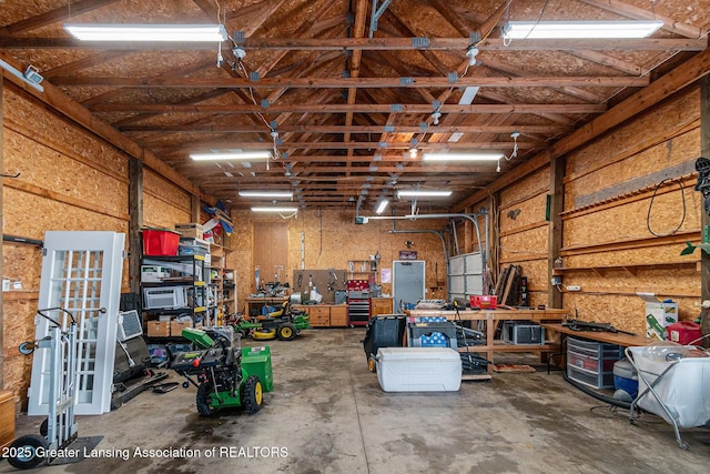 985 Ives Rd, Mason, MI 48854 - garage featuring a workshop area