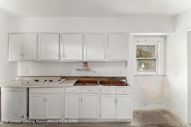 1215 Chittock Ave, Jackson, MI 49203 - kitchen with white cabinets, baseboards, and dishwasher
