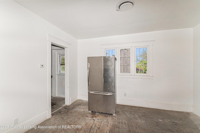 1215 Chittock Ave, Jackson, MI 49203 - spare room featuring baseboards