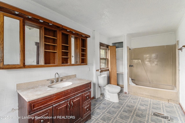 1215 Chittock Ave, Jackson, MI 49203 - full bathroom with toilet, vanity, a textured ceiling, bathtub / shower combination, and tile patterned floors