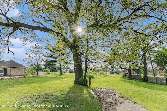 1215 Chittock Ave, Jackson, MI 49203 - view of yard with a detached garage