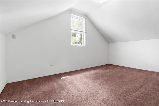 1200 W Lenawee St, Lansing, MI 48915 - bonus room featuring carpet flooring, lofted ceiling, and baseboards