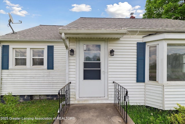2468 Lansing Rd, Charlotte, MI 48813 - entrance to property with a shingled roof