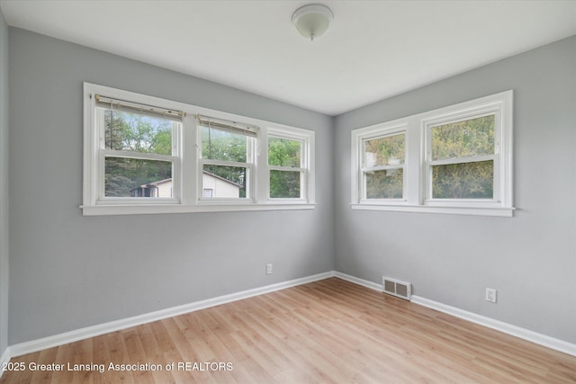 2468 Lansing Rd, Charlotte, MI 48813 - empty room with baseboards and light wood-type flooring