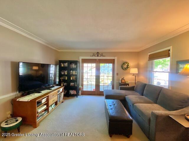 15426 Boichot Rd, Lansing, MI 48906 - living room with crown molding, carpet flooring, and french doors