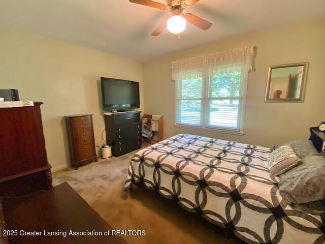 15426 Boichot Rd, Lansing, MI 48906 - carpeted bedroom with ceiling fan and lofted ceiling