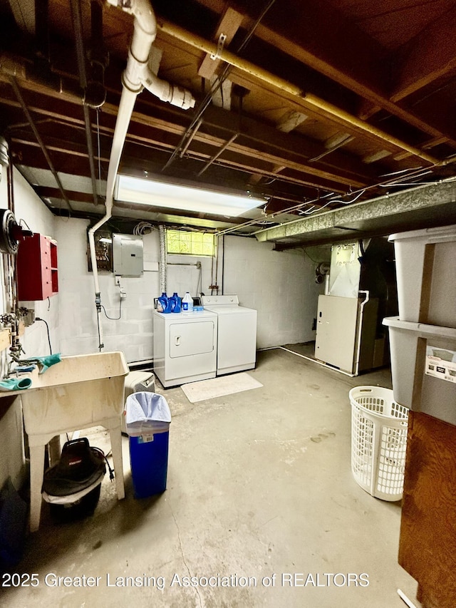1211 W Thomas L Pkwy, Lansing, MI 48917 - unfinished below grade area with washer and dryer and heating unit