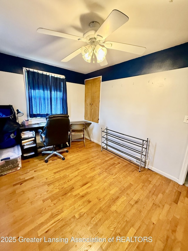 1211 W Thomas L Pkwy, Lansing, MI 48917 - home office featuring wood finished floors, baseboards, and a ceiling fan
