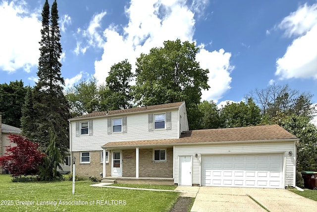 1211 W Thomas L Pkwy, Lansing, MI 48917 - traditional-style house with a garage, driveway, a front yard, a porch, and brick siding