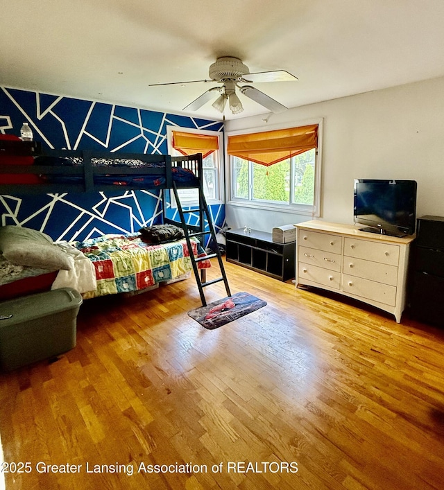 1211 W Thomas L Pkwy, Lansing, MI 48917 - bedroom featuring wood finished floors and ceiling fan