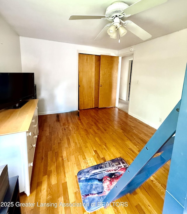 1211 W Thomas L Pkwy, Lansing, MI 48917 - unfurnished bedroom featuring wood finished floors, a closet, and a ceiling fan