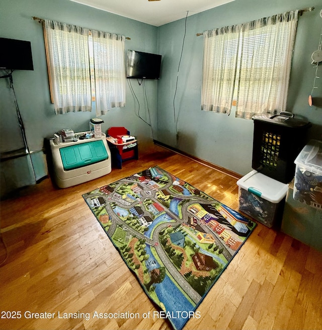 1211 W Thomas L Pkwy, Lansing, MI 48917 - living area featuring healthy amount of natural light and wood finished floors