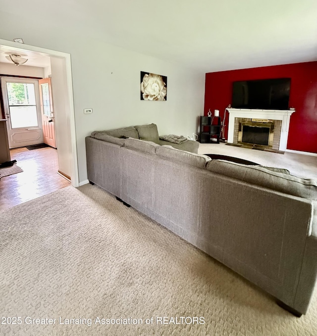 1211 W Thomas L Pkwy, Lansing, MI 48917 - carpeted living room featuring a fireplace