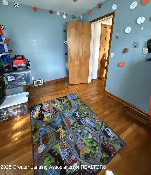 1211 W Thomas L Pkwy, Lansing, MI 48917 - bedroom with wood finished floors and baseboards