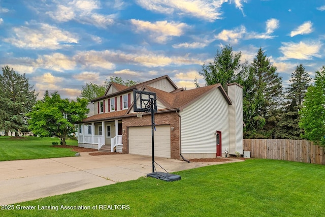 3979 Dayspring Ct, Okemos, MI 48864 - traditional-style home with driveway, a chimney, brick siding, and covered porch
