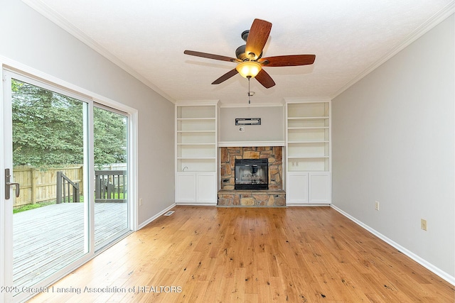 3979 Dayspring Ct, Okemos, MI 48864 - unfurnished living room with baseboards, light wood-type flooring, and built in shelves