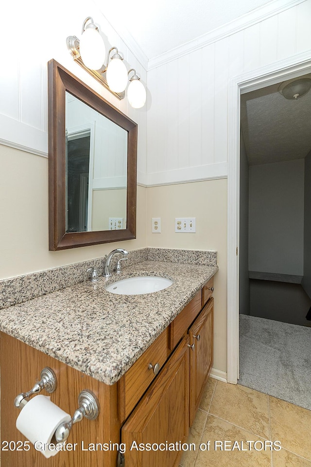 3979 Dayspring Ct, Okemos, MI 48864 - bathroom featuring vanity, crown molding, and tile patterned flooring