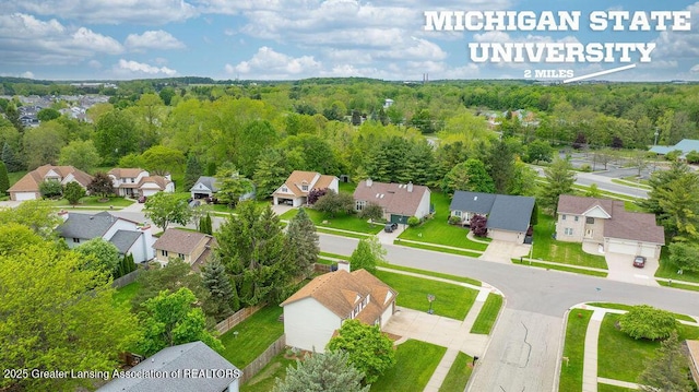 3979 Dayspring Ct, Okemos, MI 48864 - aerial perspective of suburban area with a forest