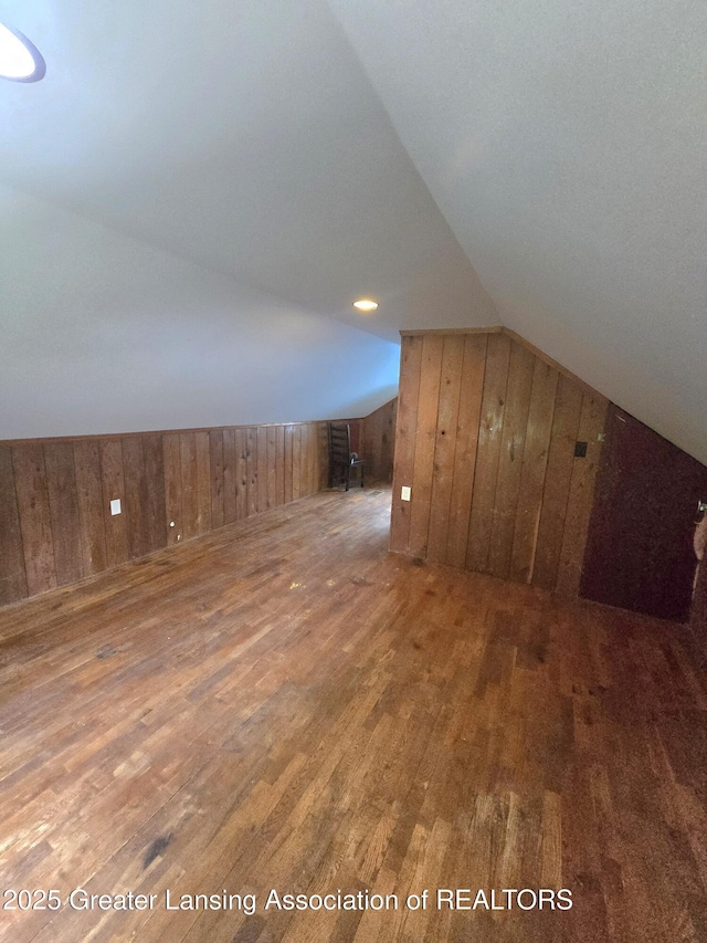 1427 Sheldon St, Lansing, MI 48906 - bonus room with hardwood / wood-style floors, wood walls, and vaulted ceiling