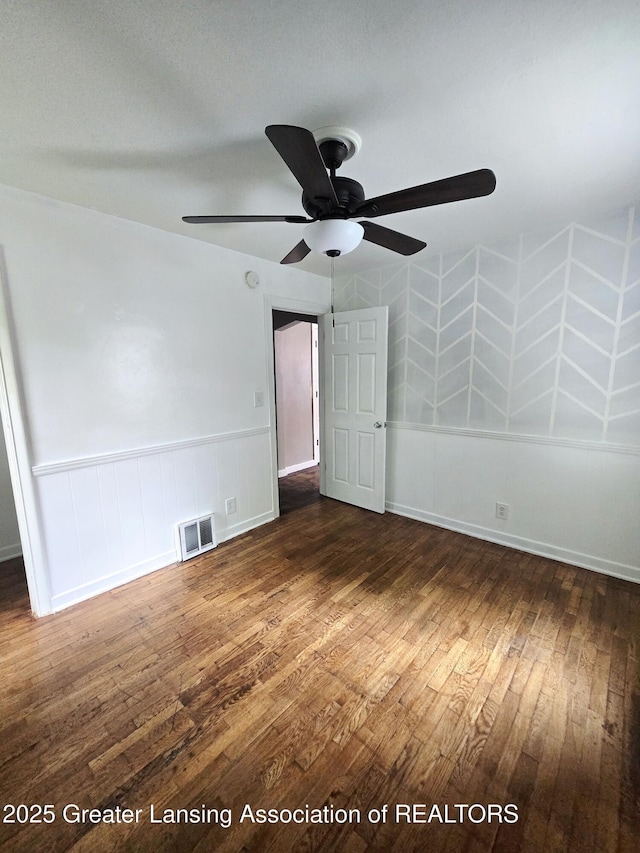 1427 Sheldon St, Lansing, MI 48906 - unfurnished bedroom featuring dark wood-type flooring and ceiling fan