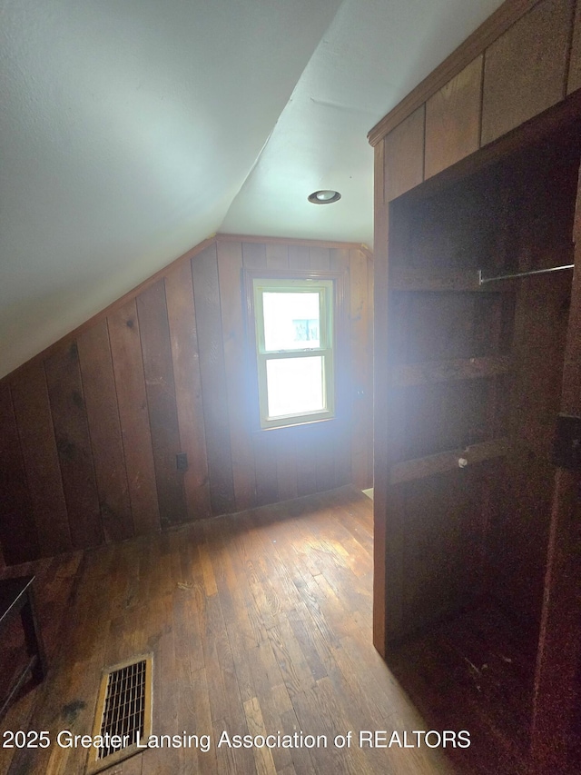 1427 Sheldon St, Lansing, MI 48906 - additional living space featuring hardwood / wood-style flooring and vaulted ceiling