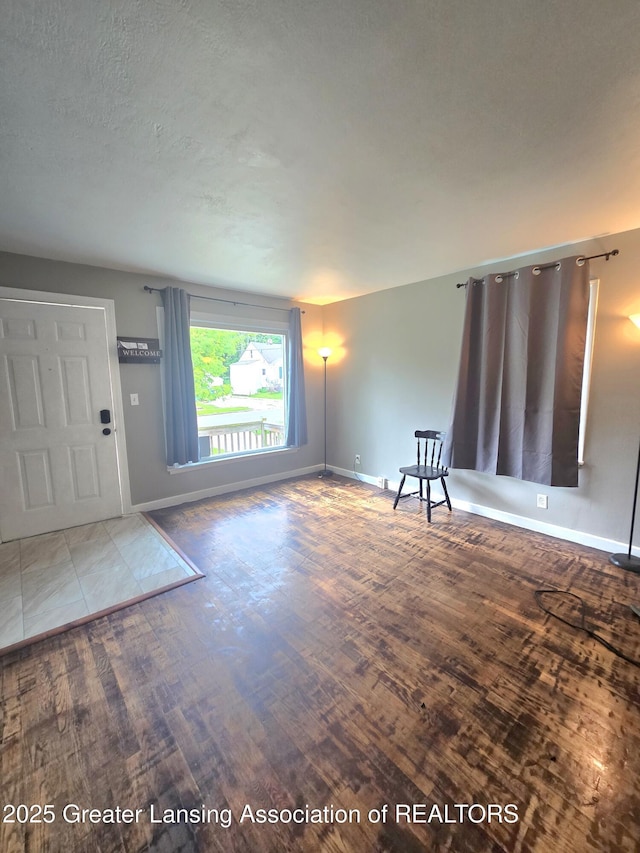 1427 Sheldon St, Lansing, MI 48906 - entryway featuring baseboards and wood finished floors