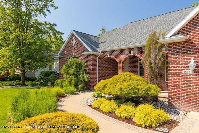 4655 Dimond Way, Dimondale, MI 48821 - view of property exterior featuring brick siding and a shingled roof