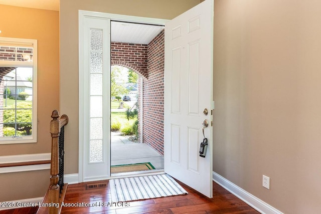 4655 Dimond Way, Dimondale, MI 48821 - foyer entrance featuring healthy amount of natural light, wood finished floors, and baseboards