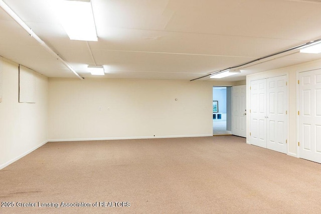 4655 Dimond Way, Dimondale, MI 48821 - finished below grade area featuring light colored carpet and baseboards