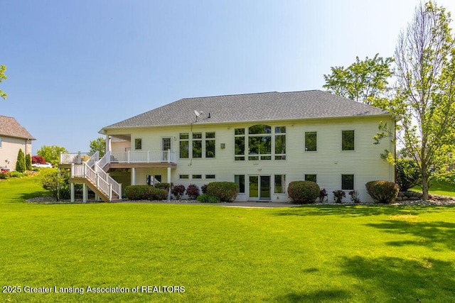 4655 Dimond Way, Dimondale, MI 48821 - back of property with stairs, a wooden deck, and a lawn