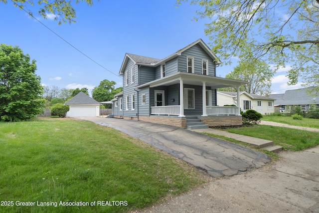828 Backus St, Jackson, MI 49202 - view of front of property featuring covered porch, an outbuilding, a front yard, and a detached garage