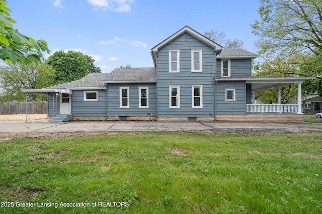 828 Backus St, Jackson, MI 49202 - rear view of property with covered porch, a shingled roof, entry steps, and a patio area