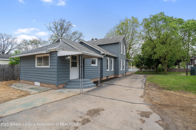 828 Backus St, Jackson, MI 49202 - bungalow with driveway and roof with shingles