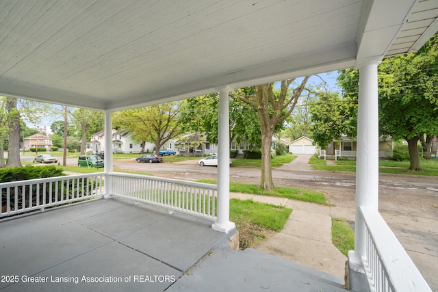 828 Backus St, Jackson, MI 49202 - view of patio / terrace with covered porch and a residential view