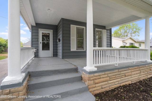 828 Backus St, Jackson, MI 49202 - property entrance with covered porch