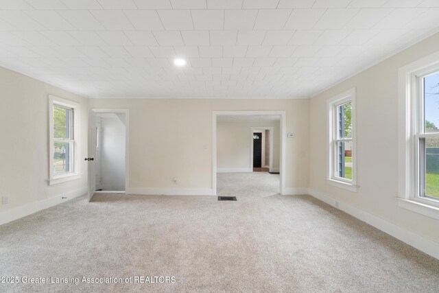 828 Backus St, Jackson, MI 49202 - empty room with light colored carpet and baseboards