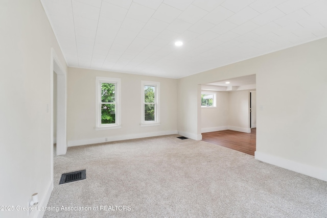 828 Backus St, Jackson, MI 49202 - carpeted empty room with baseboards and recessed lighting