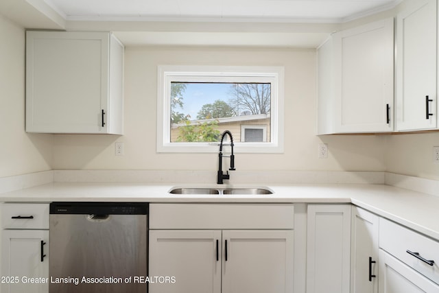 828 Backus St, Jackson, MI 49202 - kitchen featuring dishwasher, a sink, white cabinets, and light countertops