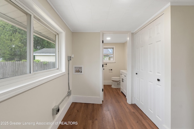 828 Backus St, Jackson, MI 49202 - laundry area featuring dark wood finished floors, washer hookup, and baseboards