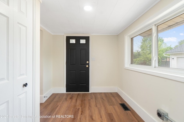 828 Backus St, Jackson, MI 49202 - foyer with wood finished floors, baseboards, and recessed lighting