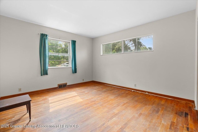 224 S Grace St, Lansing, MI 48917 - spare room featuring light wood-style flooring and baseboards