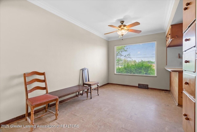 224 S Grace St, Lansing, MI 48917 - living area featuring crown molding, a ceiling fan, and baseboards